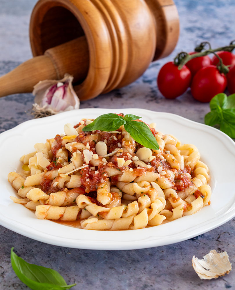 Traditional Sicilian pasta with pesto Trapanese, tomatoes and almonds
