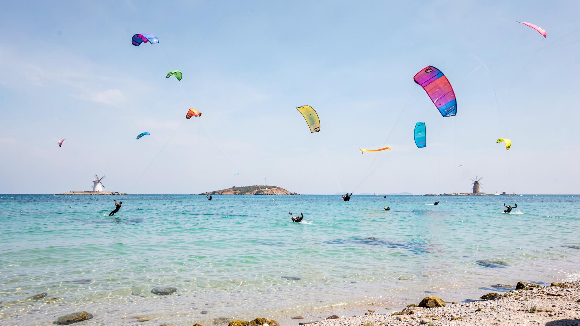 Kitesurfers on the flat shallow water of the Lo Stagnone lagoon